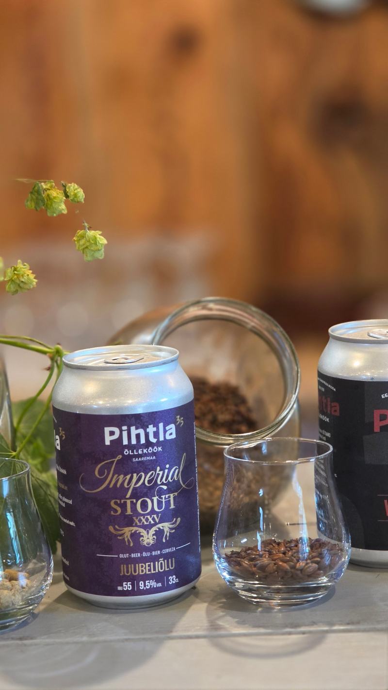 Imperial Stout XXXV juubeliõlu purk ja klaas linnastega